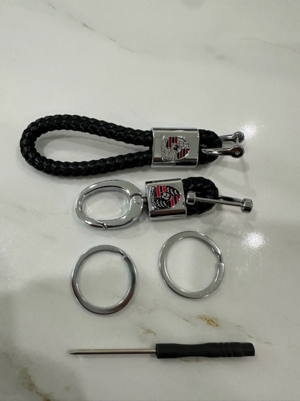 Black Braided Leather Keychain with Silver Emblem Porsche